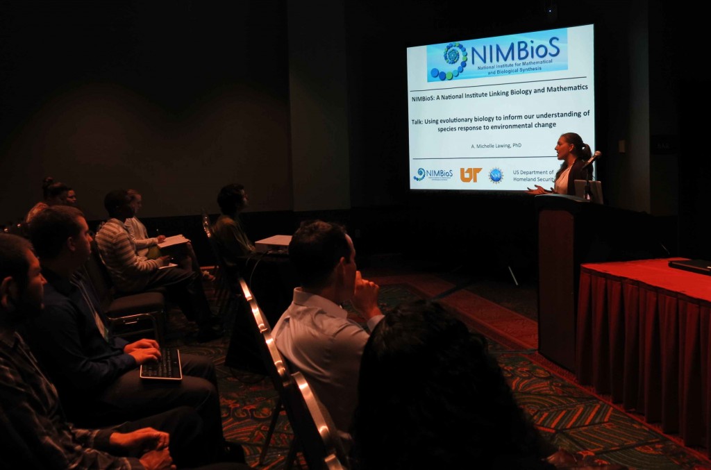 Anna Michelle Lawing, NIMBioS postdoctoral fellow, presents at a symposium at the SACNAS conference.