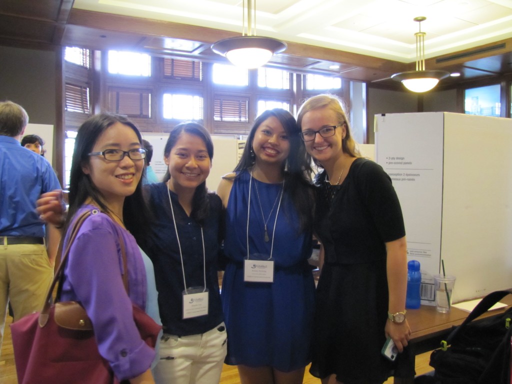 NIMBioS SRE's Fanguyan Hong, Michelle Cruz, Brittany Boribong and Nikki Rooks amid posters at the STEM Symposium